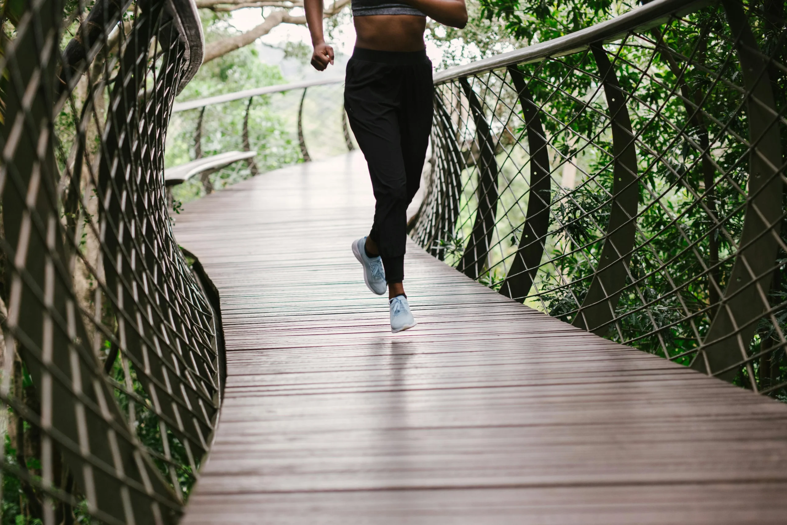 of_a_person_jogging_or_cycling_outdoors_to_promote_cardiovascular_health__Create_an_ultra_realistic_image_with_perfect_contrast_by_emphasizing_depth