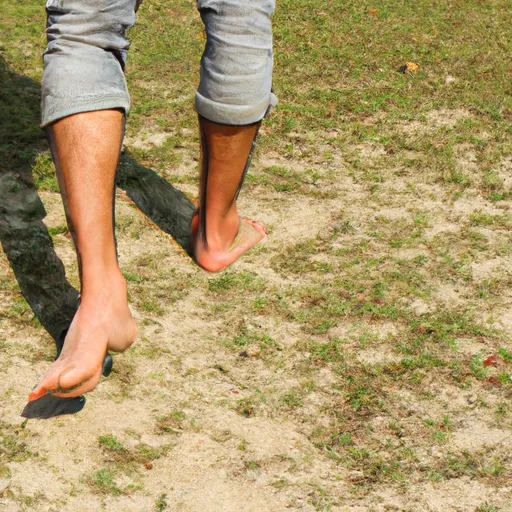of_a_person_walking_barefoot_on_grass_or_sand