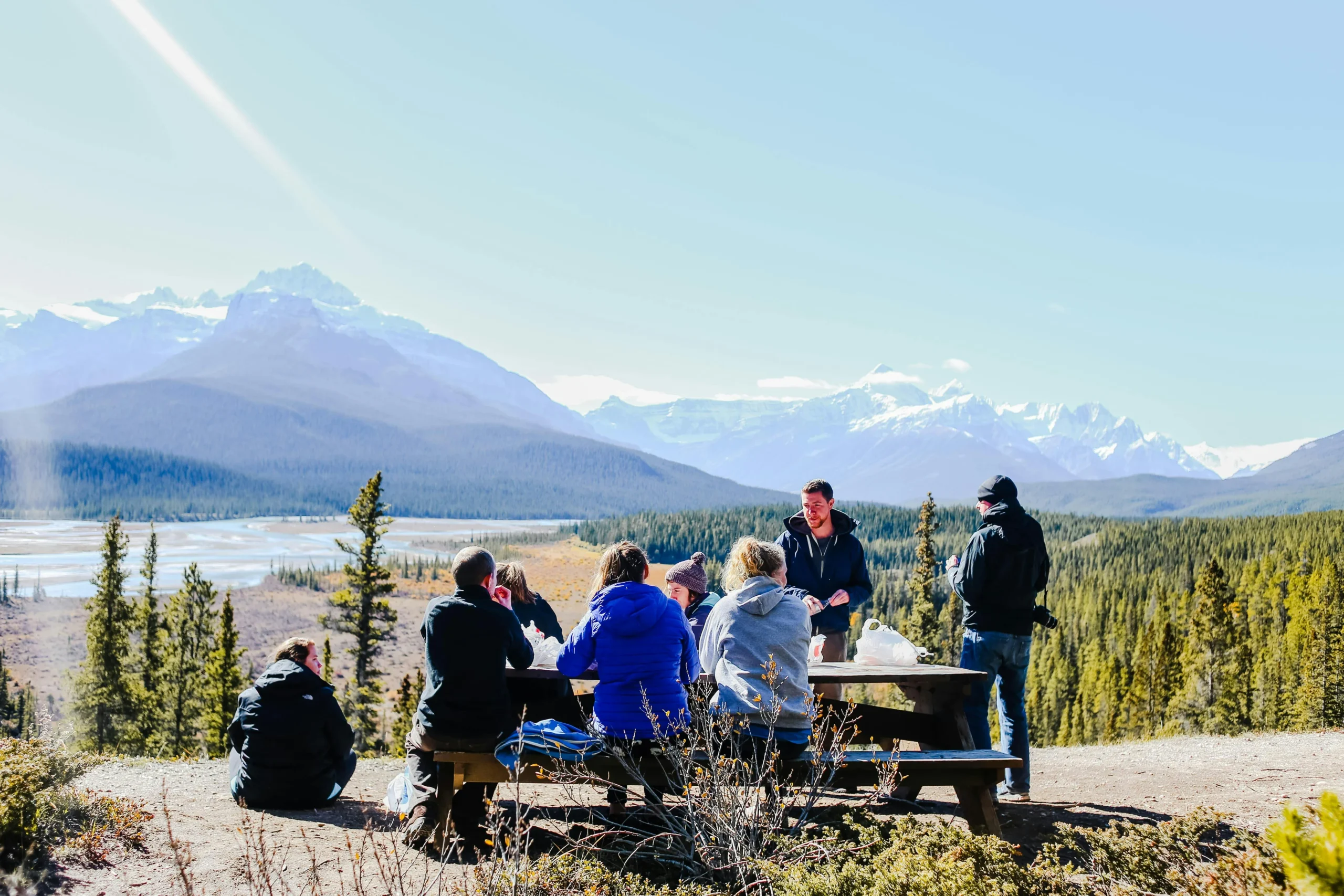 of_a_family_hiking_on_a_scenic_trail_surrounded_by_mountains_and_trees__Create_an_ultra_realistic_image_with_perfect_contrast_by_emphasizing_depth