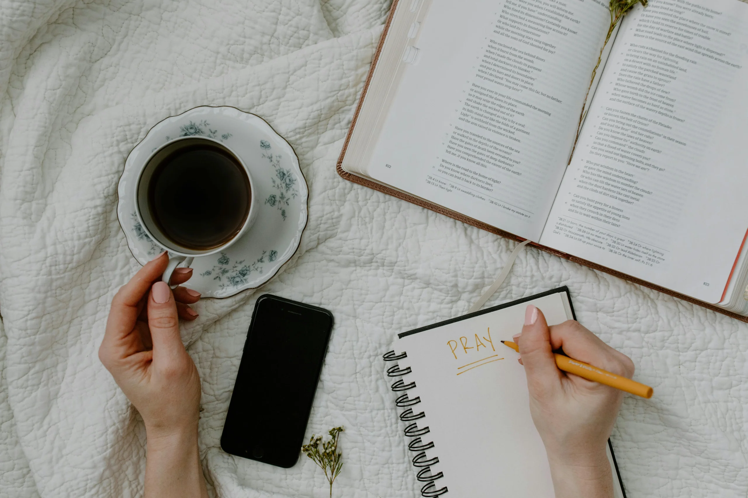 of_a_journal_with_gratitude_notes_and_a_pen_beside_a_cup_of_tea__Create_an_ultra_realistic_image_with_perfect_contrast_by_emphasizing_depth