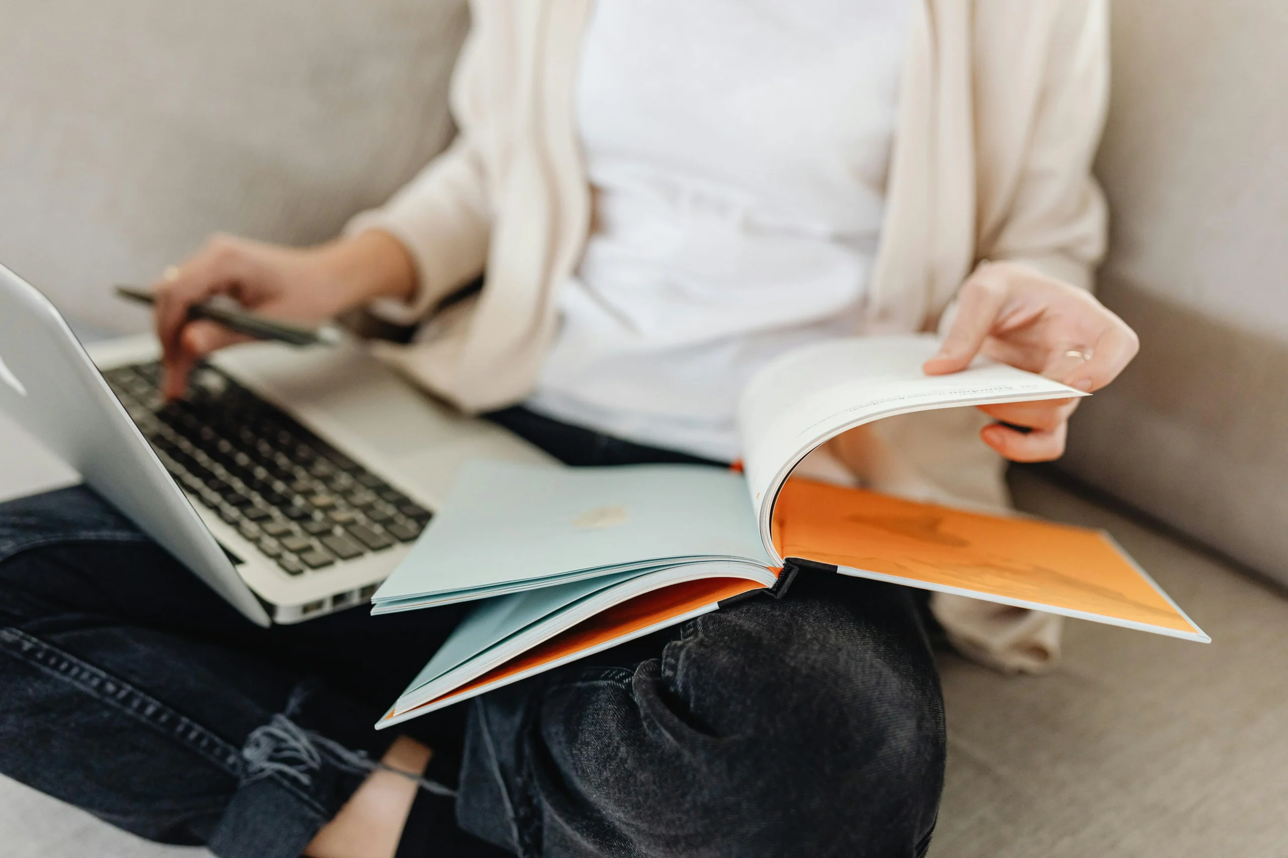 of_a_person_lounging_on_a_couch_with_a_book