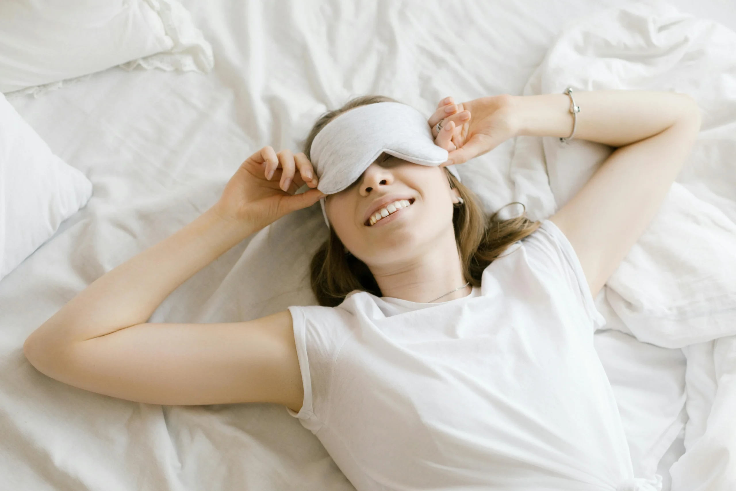 of_a_person_lying_in_bed_with_soft_lighting_and_a_sleep_mask__Create_an_ultra_realistic_image_with_perfect_contrast_by_emphasizing_depth