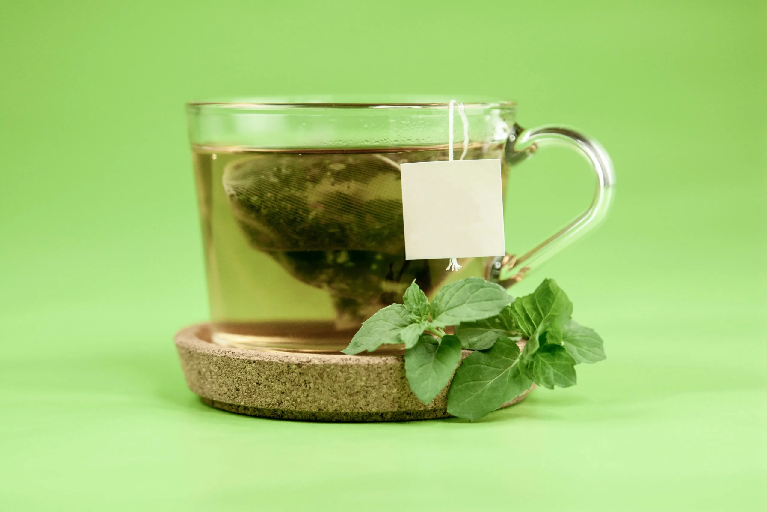 of_a_steaming_cup_of_herbal_tea_with_fresh_herbs_like_mint
